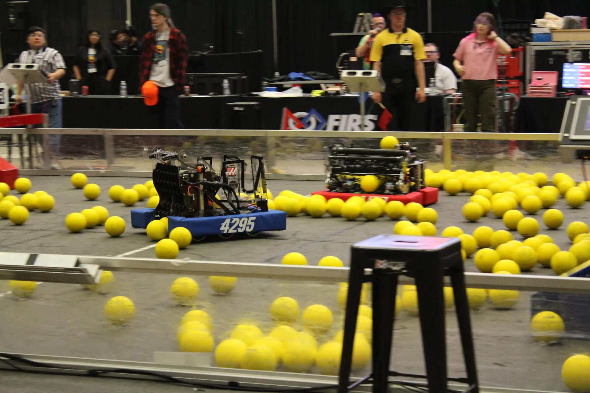 FRC Team 4295 Hudson Stingers robot grabbing fuel on the field