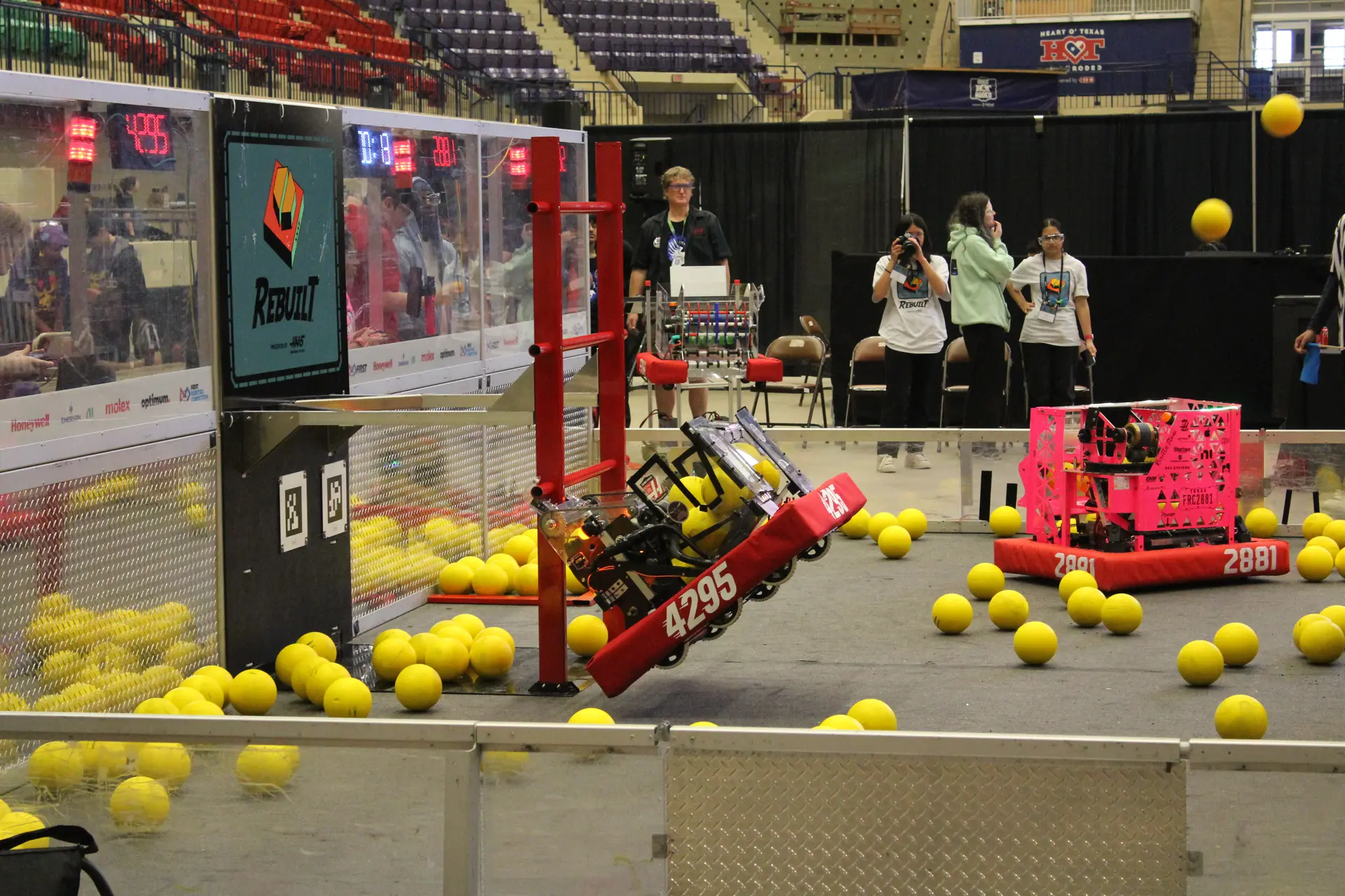 FRC Team 4295 Hudson Stingers robot climbing in Red Alliance